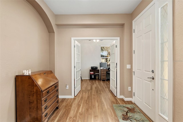 hall with light hardwood / wood-style floors