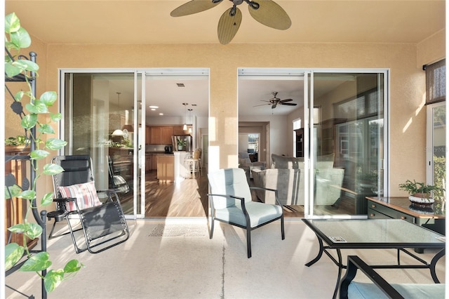 view of patio featuring ceiling fan