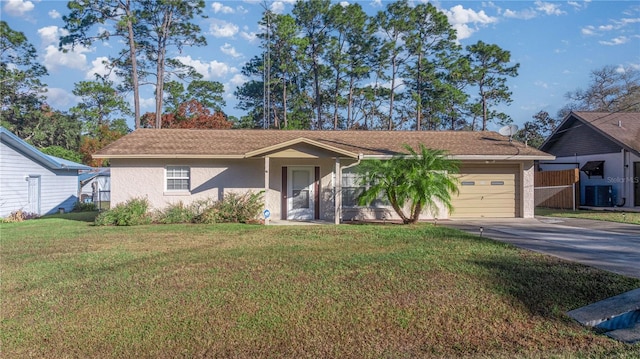 ranch-style house featuring a front lawn, central AC unit, and a garage