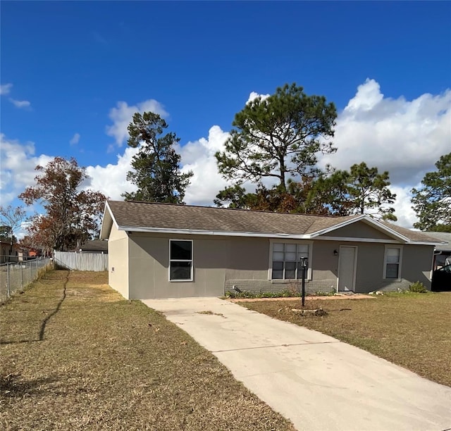 ranch-style house with a front lawn