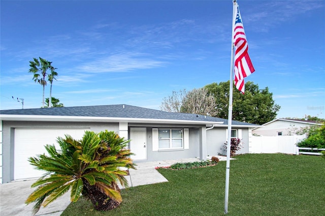 ranch-style house with a front yard and a garage