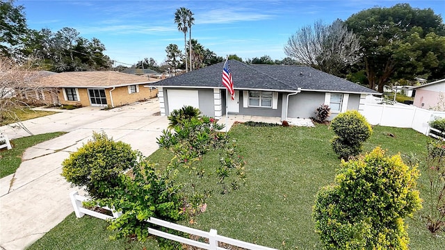 ranch-style home with a garage and a front lawn