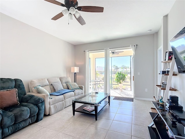 living room featuring ceiling fan and light tile patterned flooring