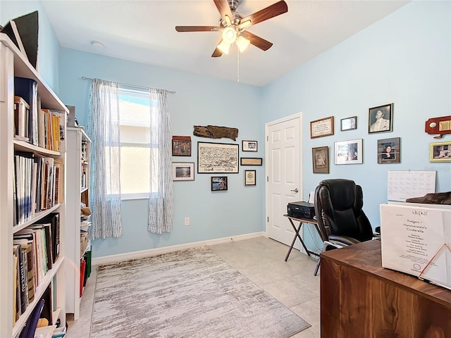 tiled office featuring ceiling fan