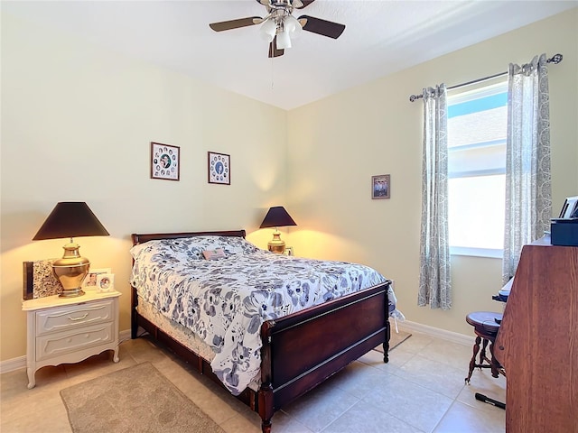 bedroom with ceiling fan and light tile patterned flooring