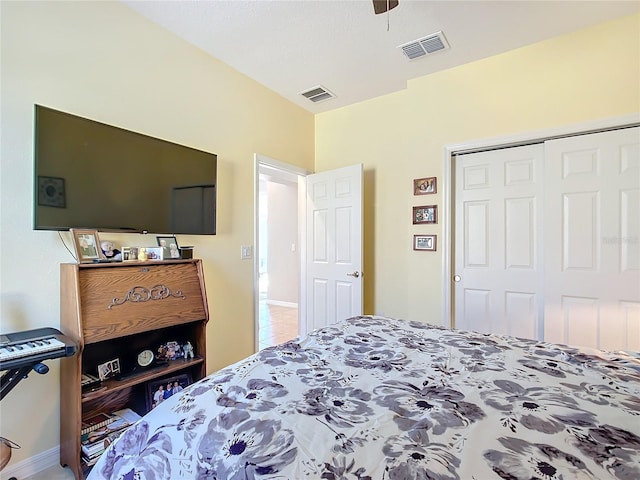 bedroom with ceiling fan and a closet