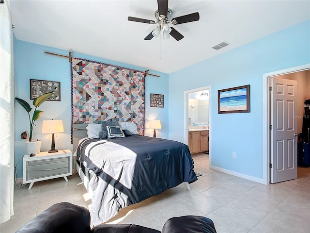 tiled bedroom with ceiling fan and connected bathroom