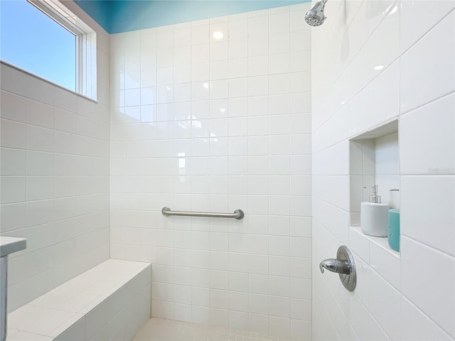 bathroom featuring tiled shower