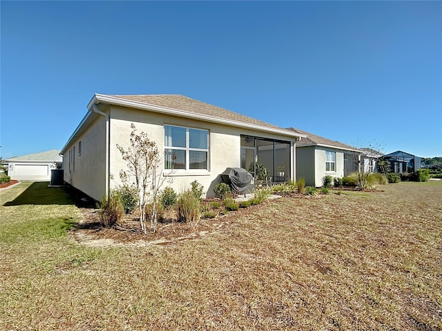 view of side of home featuring a yard