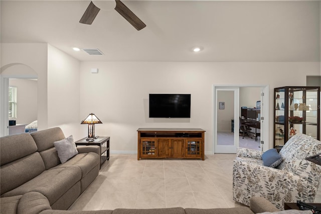 living room with ceiling fan and light tile patterned floors