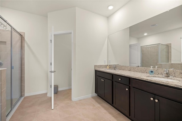 bathroom featuring vanity, tile patterned floors, and an enclosed shower