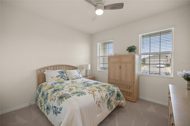 bedroom featuring ceiling fan and light colored carpet