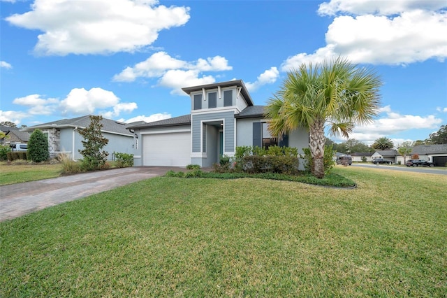 view of front of house with a garage and a front yard