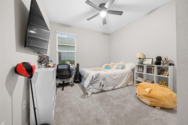 bedroom featuring light colored carpet and ceiling fan