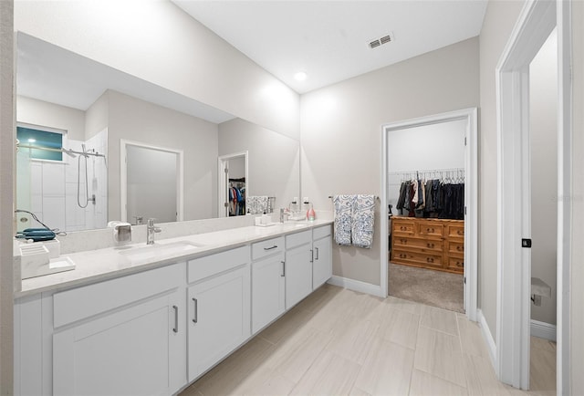 bathroom featuring vanity and an enclosed shower