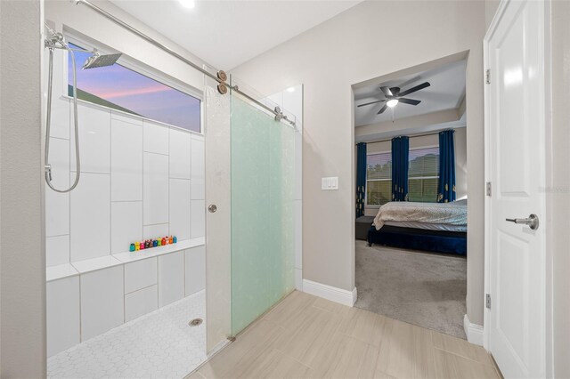 bathroom featuring tile patterned flooring, ceiling fan, and walk in shower