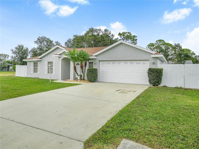 single story home with a garage and a front yard