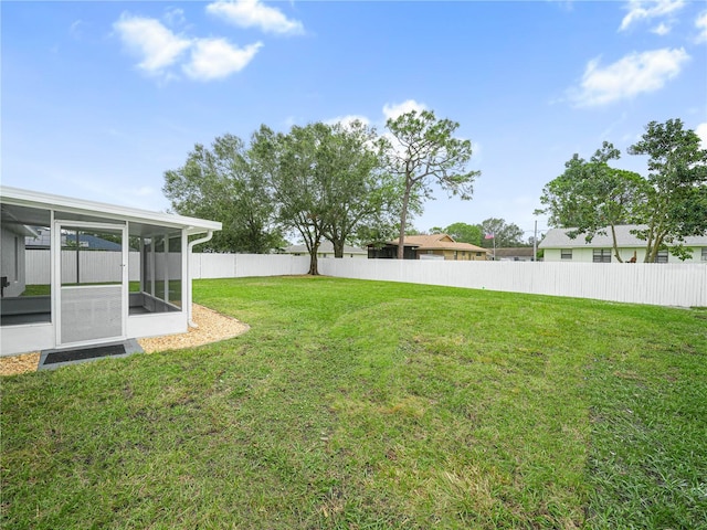 view of yard featuring a sunroom