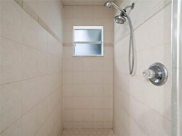 bathroom with tiled shower