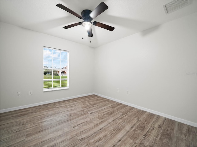 unfurnished room with light hardwood / wood-style flooring and ceiling fan