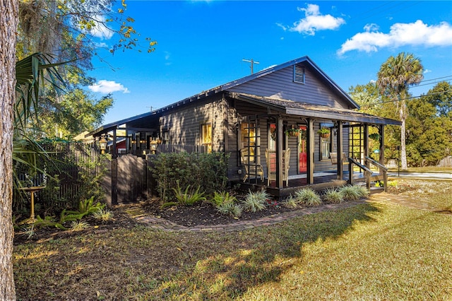 exterior space with a yard and a porch