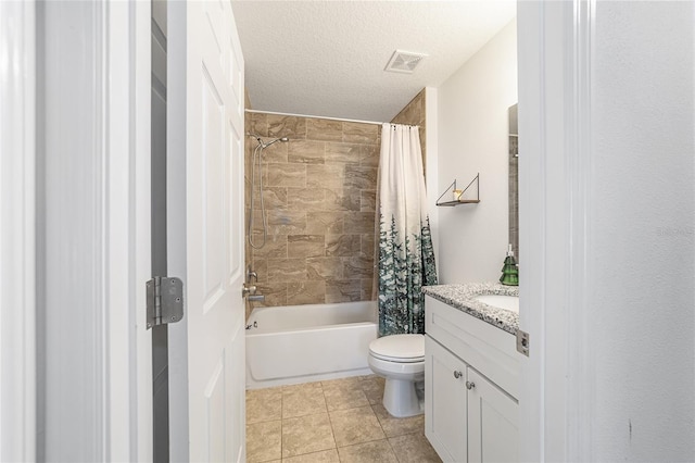 full bathroom with tile patterned floors, a textured ceiling, toilet, vanity, and shower / tub combo