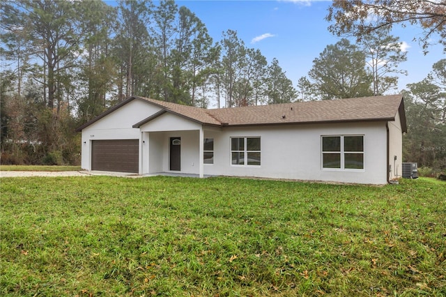 single story home with a front yard, a garage, and cooling unit