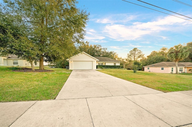 ranch-style house featuring a garage and a front yard