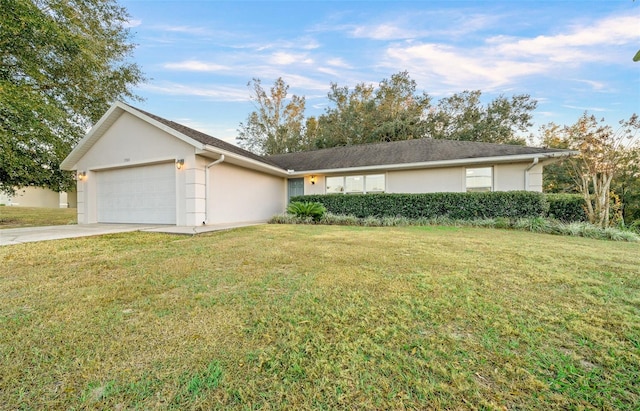 ranch-style home featuring a front yard and a garage