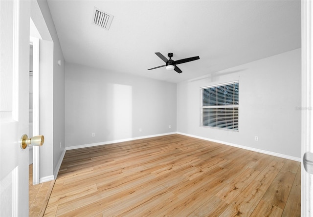 empty room with ceiling fan and light wood-type flooring