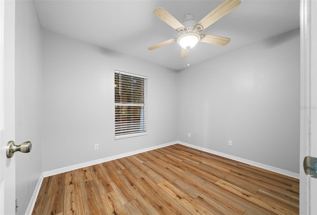 unfurnished room with ceiling fan and hardwood / wood-style floors