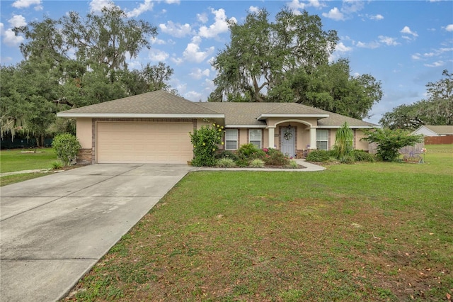 ranch-style house featuring a front yard and a garage