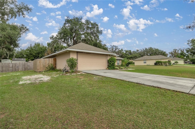 exterior space with a garage and a yard