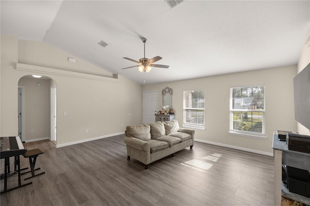 sitting room featuring ceiling fan, dark hardwood / wood-style flooring, a textured ceiling, and vaulted ceiling