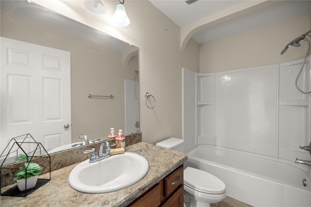 full bathroom featuring vanity, toilet, and shower / bathtub combination