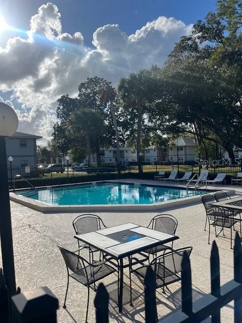 view of swimming pool with a patio area