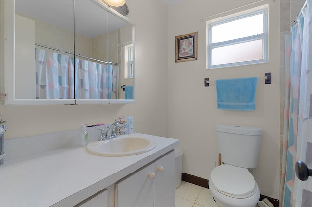 bathroom featuring tile patterned flooring, vanity, and toilet