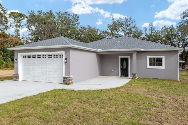 view of front of house featuring a garage and a front lawn