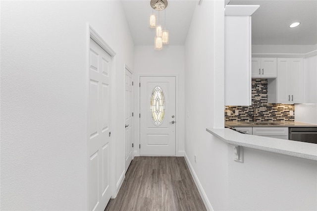 entryway featuring light wood-type flooring and sink