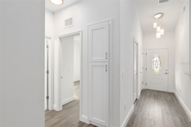 hallway featuring light wood-type flooring