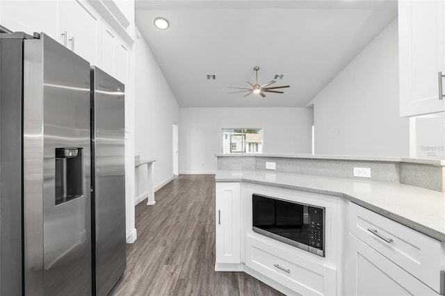 kitchen featuring appliances with stainless steel finishes, hardwood / wood-style flooring, white cabinetry, and ceiling fan