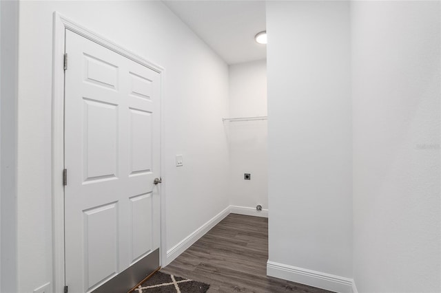 laundry area with electric dryer hookup and dark wood-type flooring