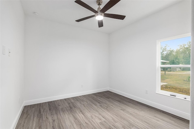 unfurnished room featuring ceiling fan and light wood-type flooring