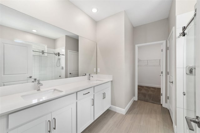 bathroom with vanity and an enclosed shower