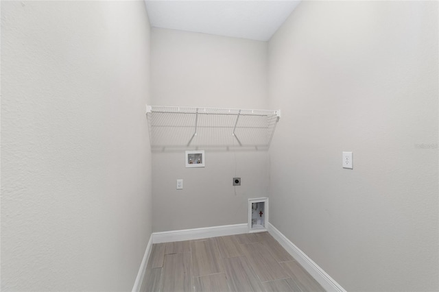 laundry room featuring hardwood / wood-style flooring, washer hookup, and hookup for an electric dryer