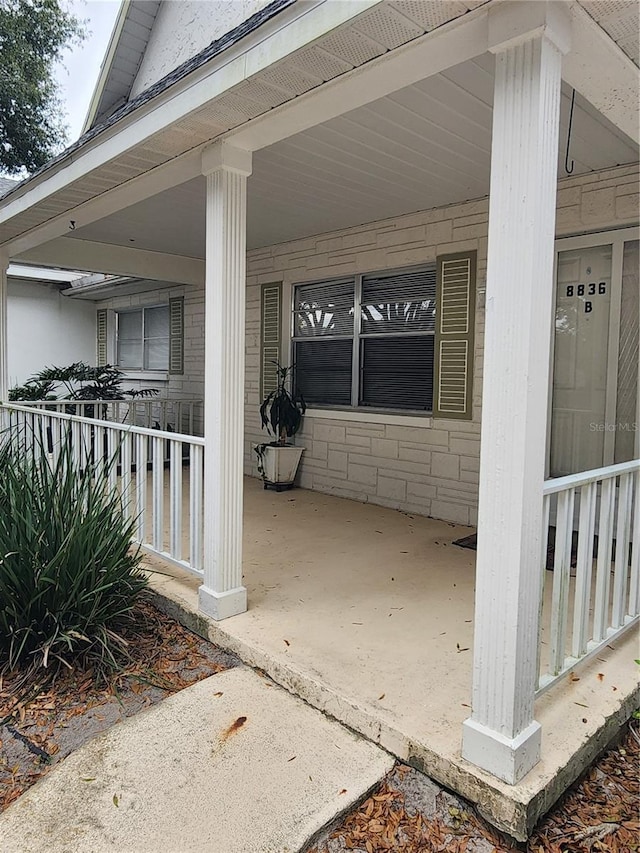 view of patio featuring a porch