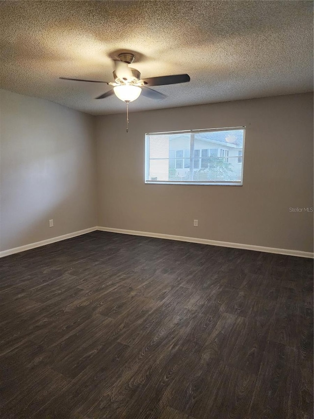 unfurnished room featuring a textured ceiling, ceiling fan, and dark hardwood / wood-style floors