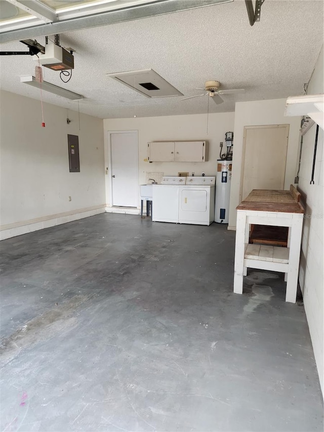 garage featuring a garage door opener, electric panel, sink, washing machine and dryer, and water heater