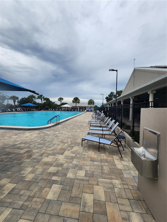 view of pool featuring a patio