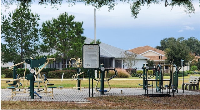 surrounding community with a yard and a playground